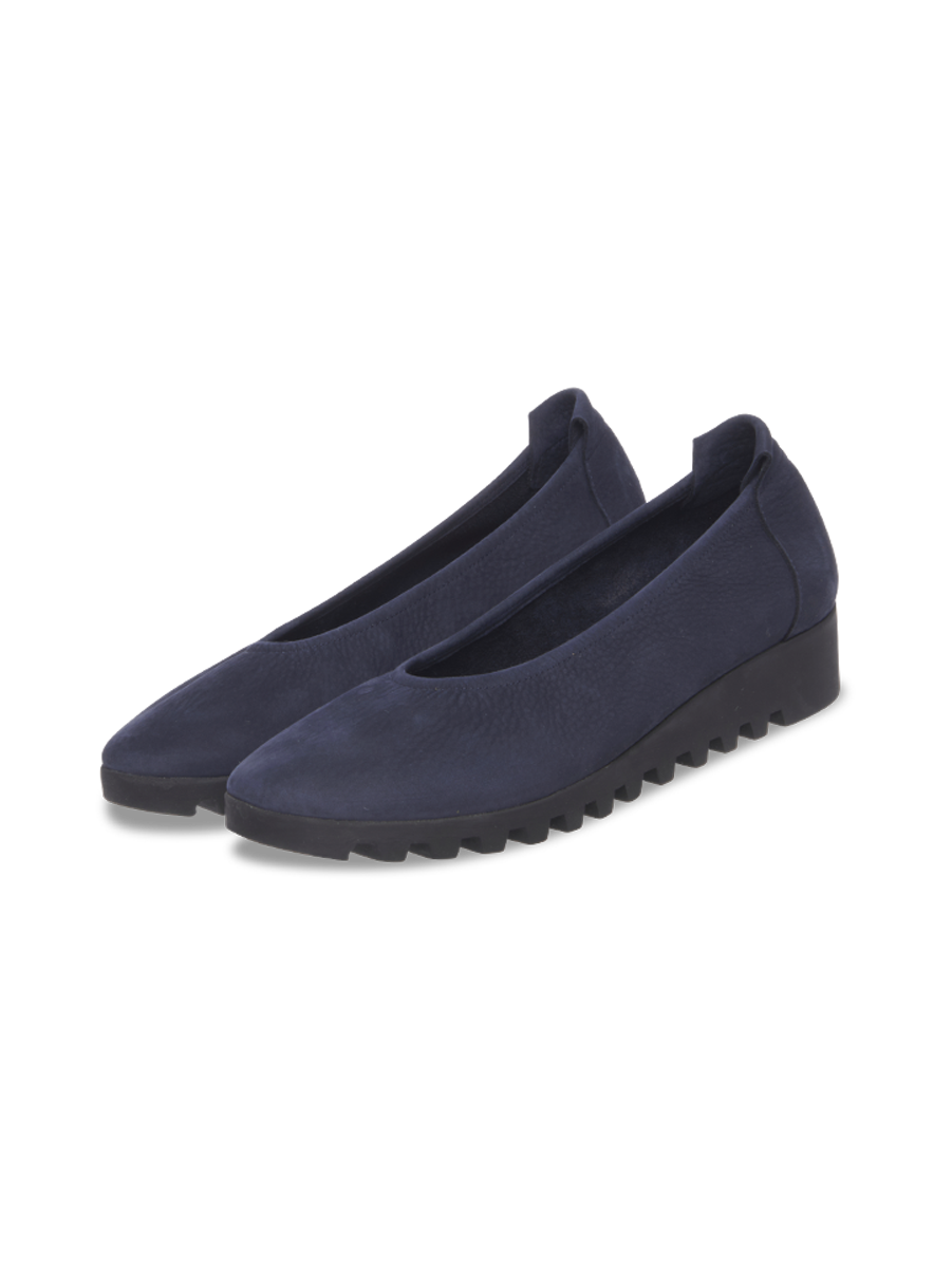 A pair of navy nubuck ballet flats with elasticated upper and notched wedge latex sole.